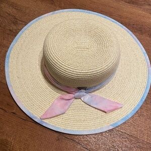 Sun “n” Sand floppy hat with light pink a smile blue bow and blue trim. UPF 50